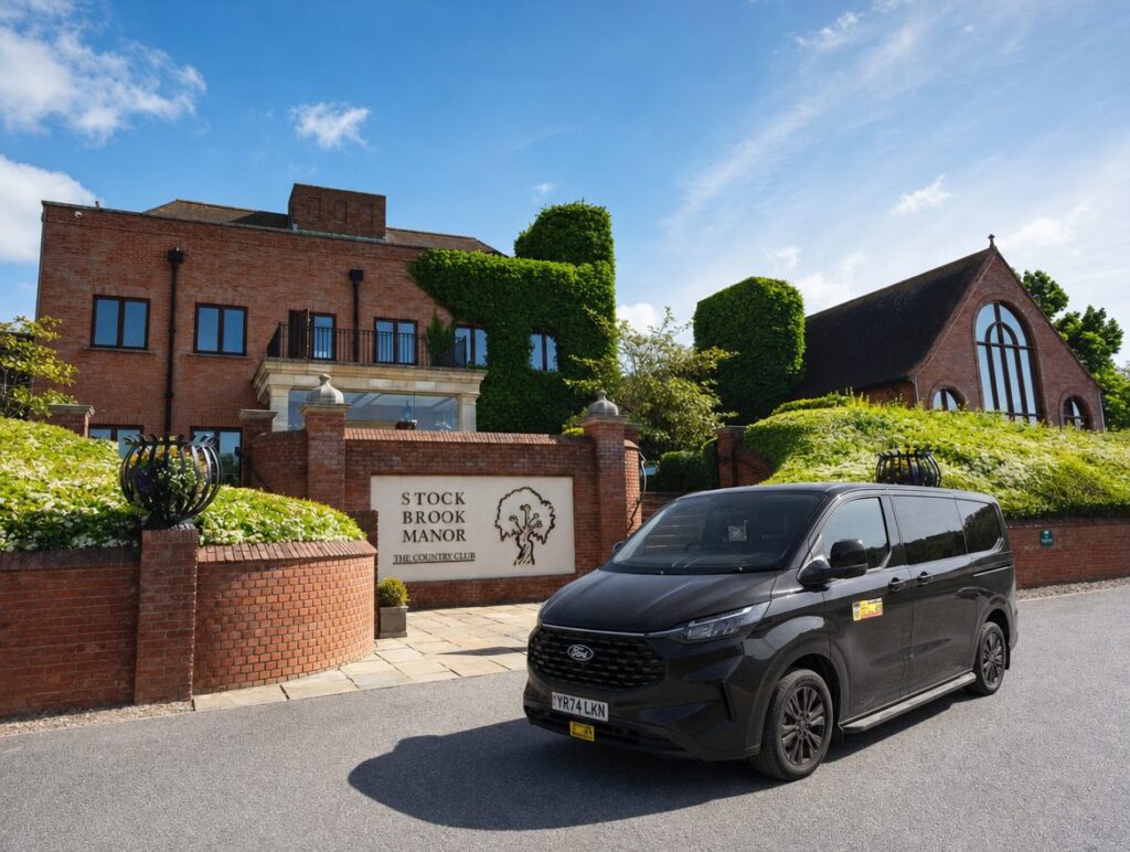 Black minibus taxi outside a venue